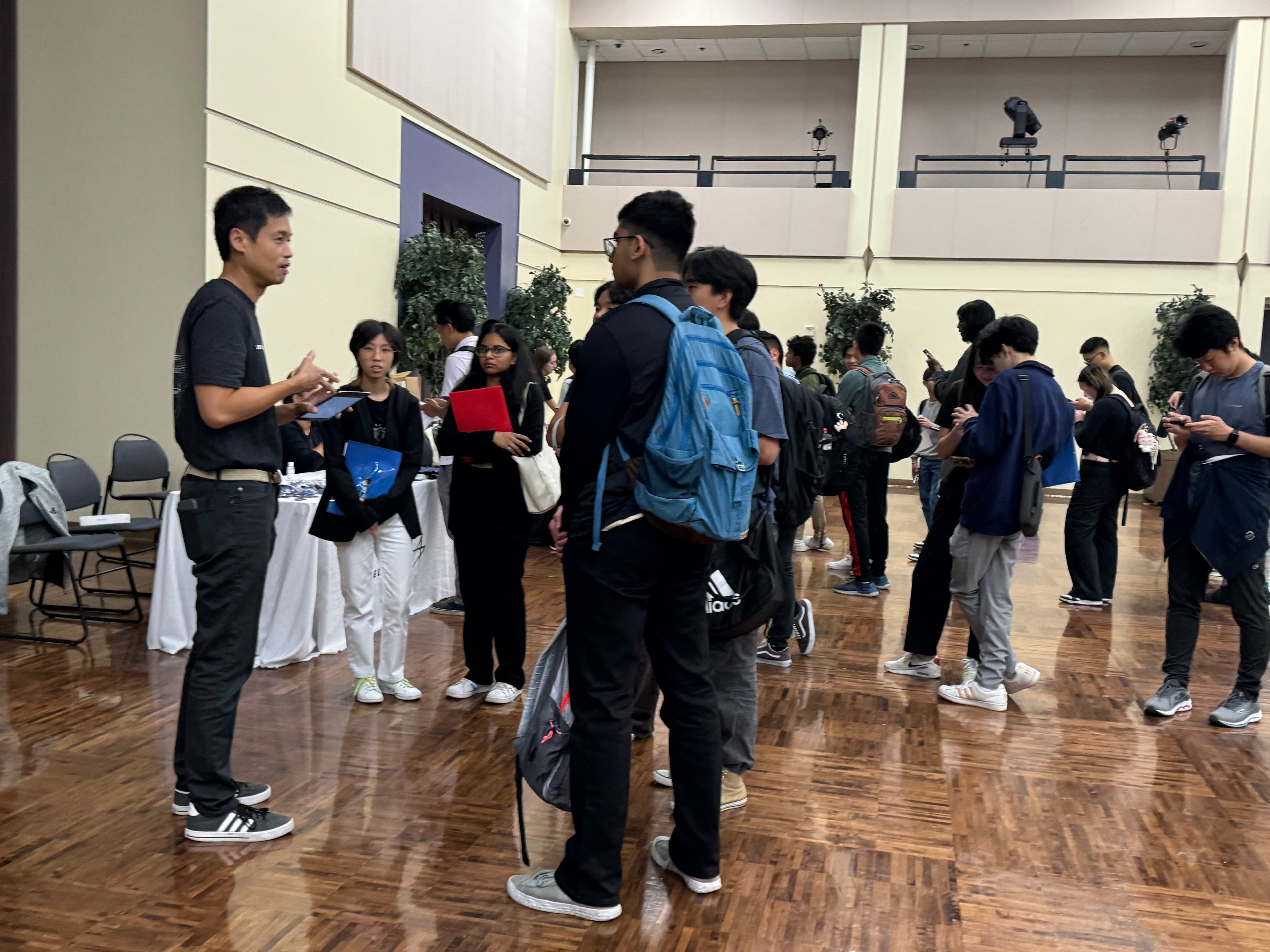 students talk to a recruiter at SPACE